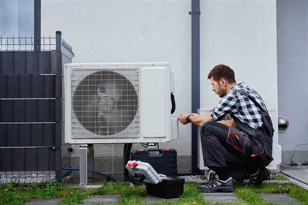 Ductless mini-split installation by a GreenShield technician
