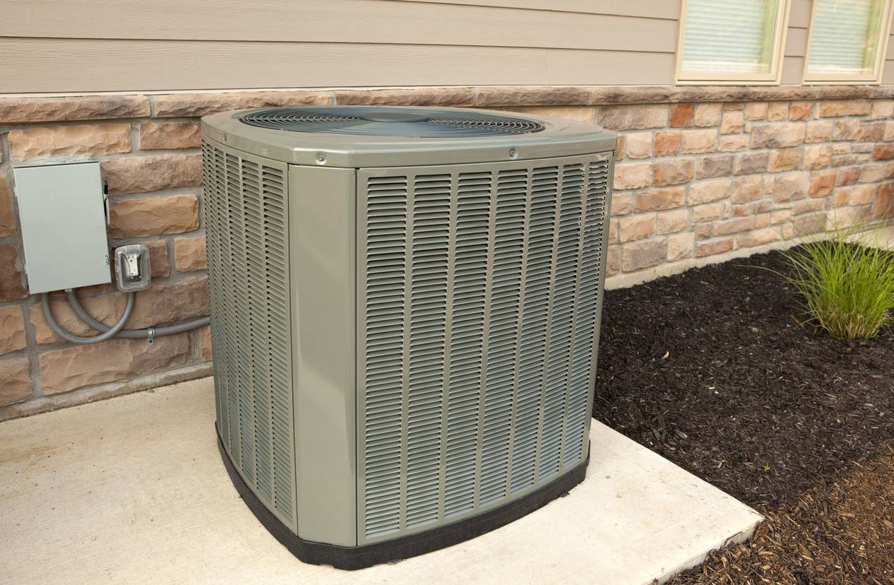 New heat pump outdoor unit replacing older equipment at a Hempstead, NY home